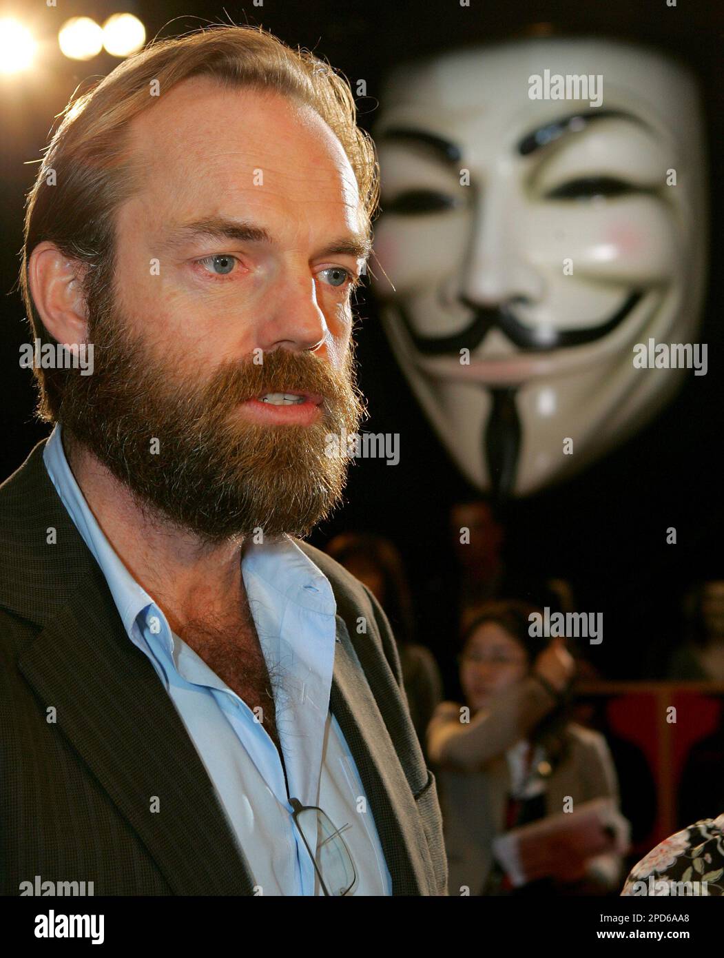 Hugo Weaving speaks to a TV reporter upon his arrival for the Tokyo premier  of his latest film V for Vendetta Monday, April 17, 2006. The political  action thriller, that stars Weaving