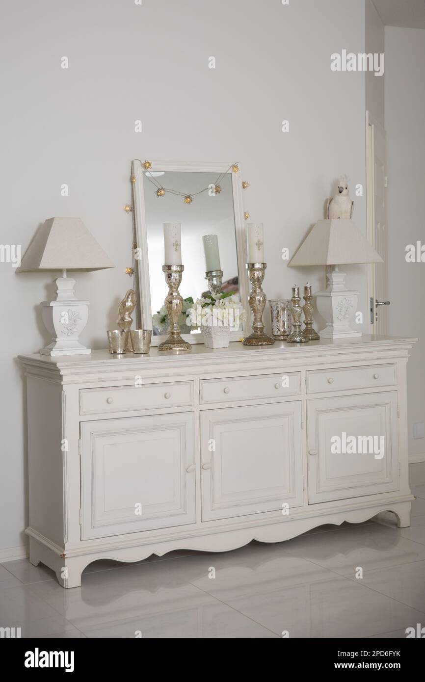 Interior of a dressing room with a mirror and a chest of drawers Stock