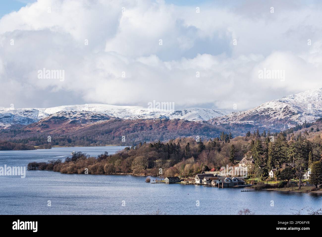 14th March  2023 .UK Weather Afternoon sun on snow covered  fells  above and around   Lake Windermere   Credit: Gordon Shoosmith/ Live News Stock Photo