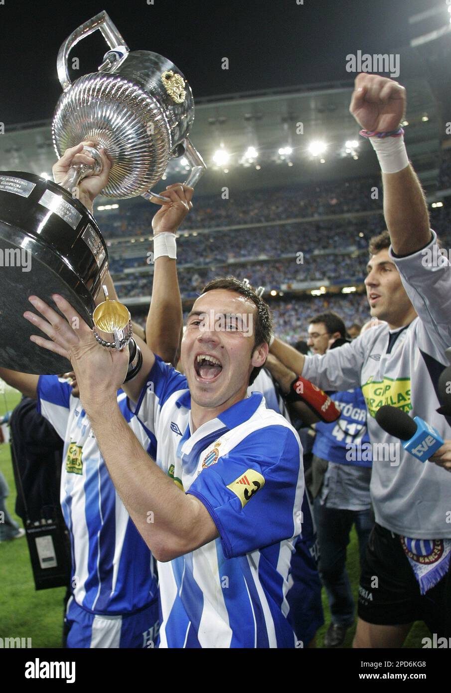 Espanyol player David Garcia de La Cruz from Spain celebrates holding the  King's Cup after beating Zaragoza 4-1 in the King's Cup final soccer match  in the Bernabeu stadium in Madrid, Wednesday,