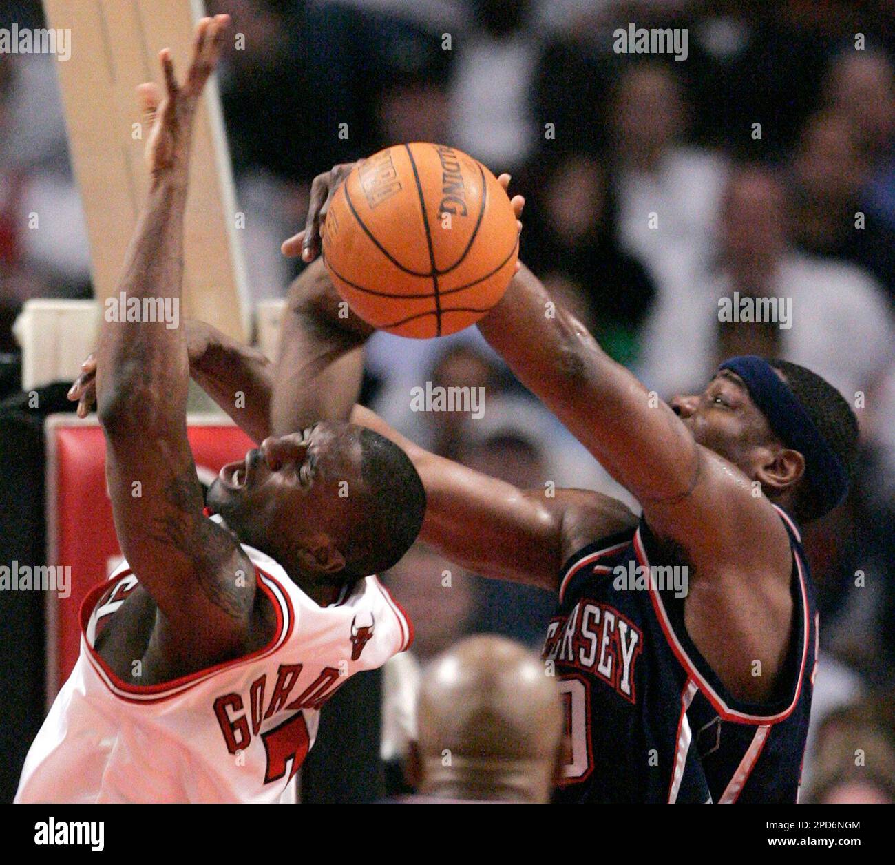 New Jersey Nets Clifford Robinson right blocks a shot attempt