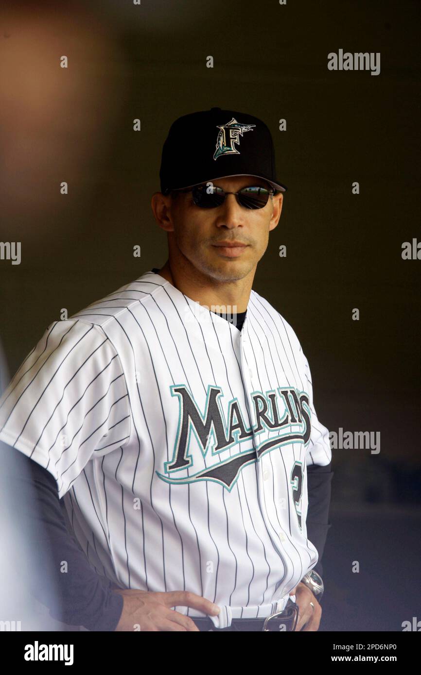 Florida Marlins manager Joe Girardi looks at the field during the team's  home opener baseball game against the San Diego Padres Tuesday, April 11,  2006, in Miami. The Pasres won 9-3. (AP