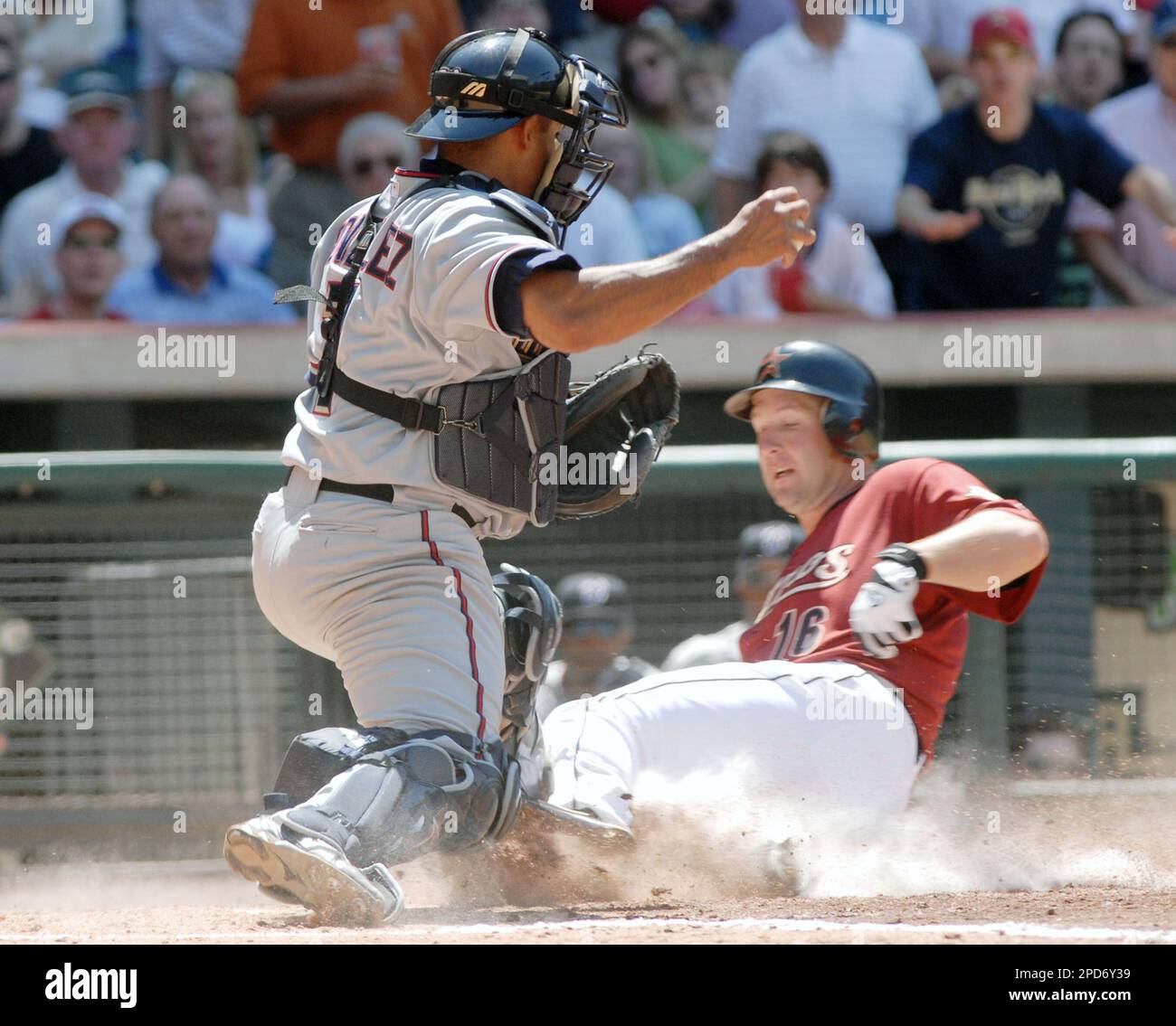 Washington Nationals catcher, Wiki Gonzales ttries to but fails to tag  Houston Astros' Jason Lane as Lane scores from third on a ground ball by  Adam Everett in the fourth inning of