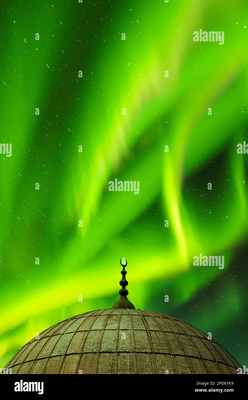A dome from one of the many Mosques in Istanbul against an aurora sky background. Stock Photo