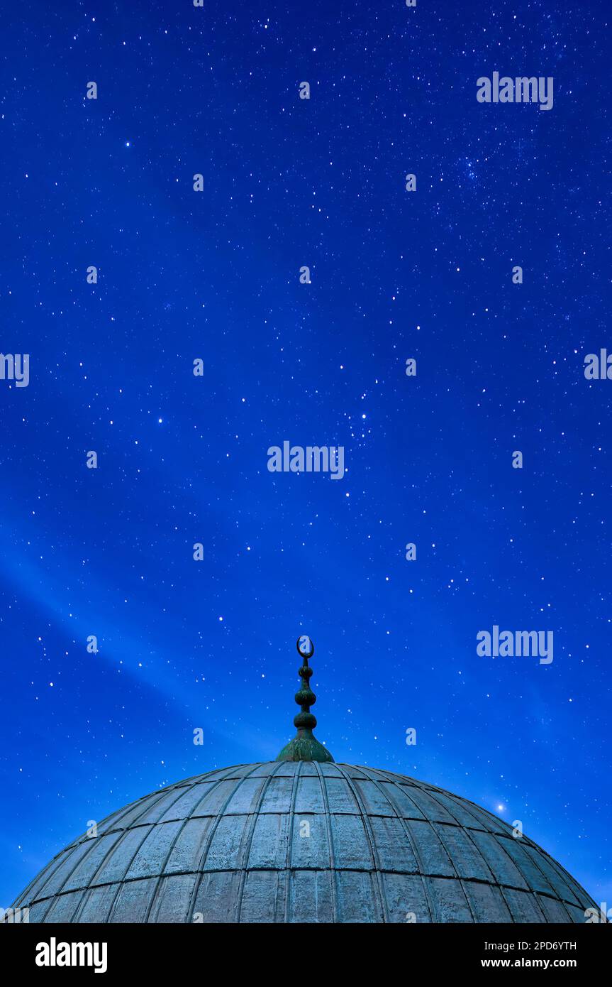 A dome from one of the many Mosques in Istanbul against a starry night sky background. Stock Photo