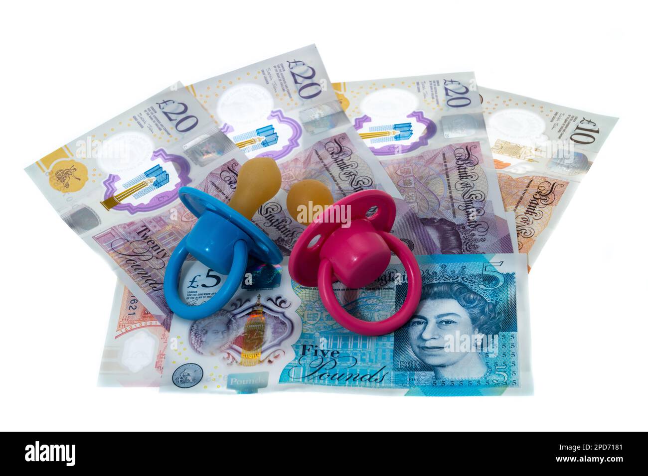 The ever increasing cost of infant childcare with UK currency  and baby pacifiers - white background. Stock Photo
