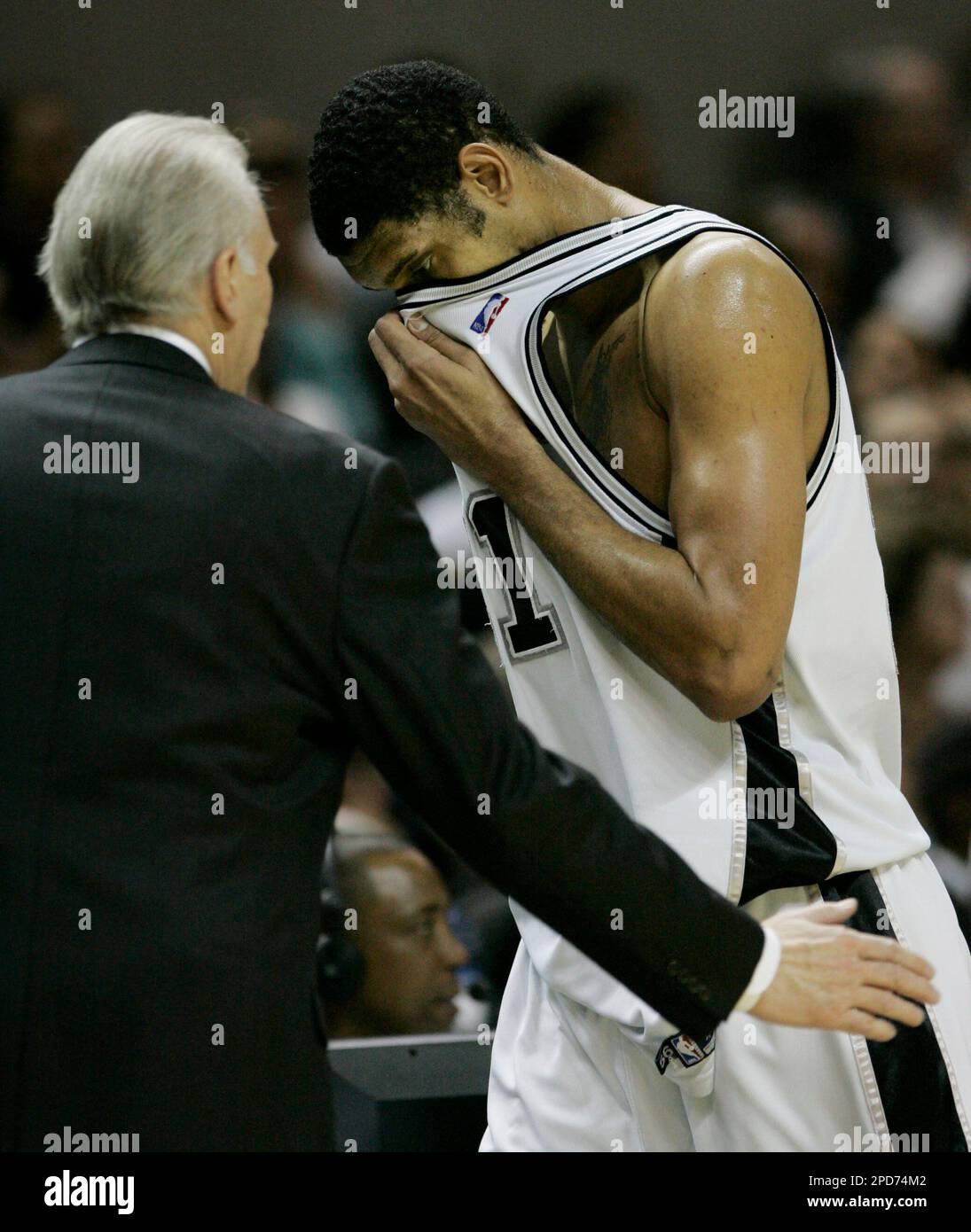 San Antonio Spurs forward Tim Duncan is met at the bench by coach Gregg ...