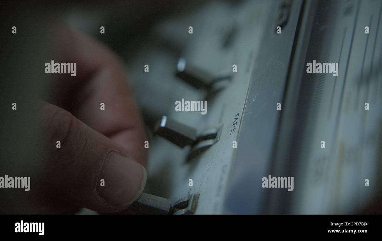 Close-up Shot of Human Fingers Pressing Buttons on Boombox Tape Player Stock Photo