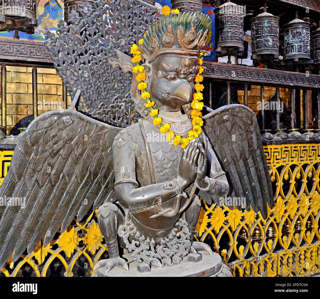 figure decorated with flower garland ,Rudra Varna Newar ( Uku Bahal) Buddhist Monastery , Rudravarna Mahavihar, Durbar square, Patan, Nepal Stock Photo