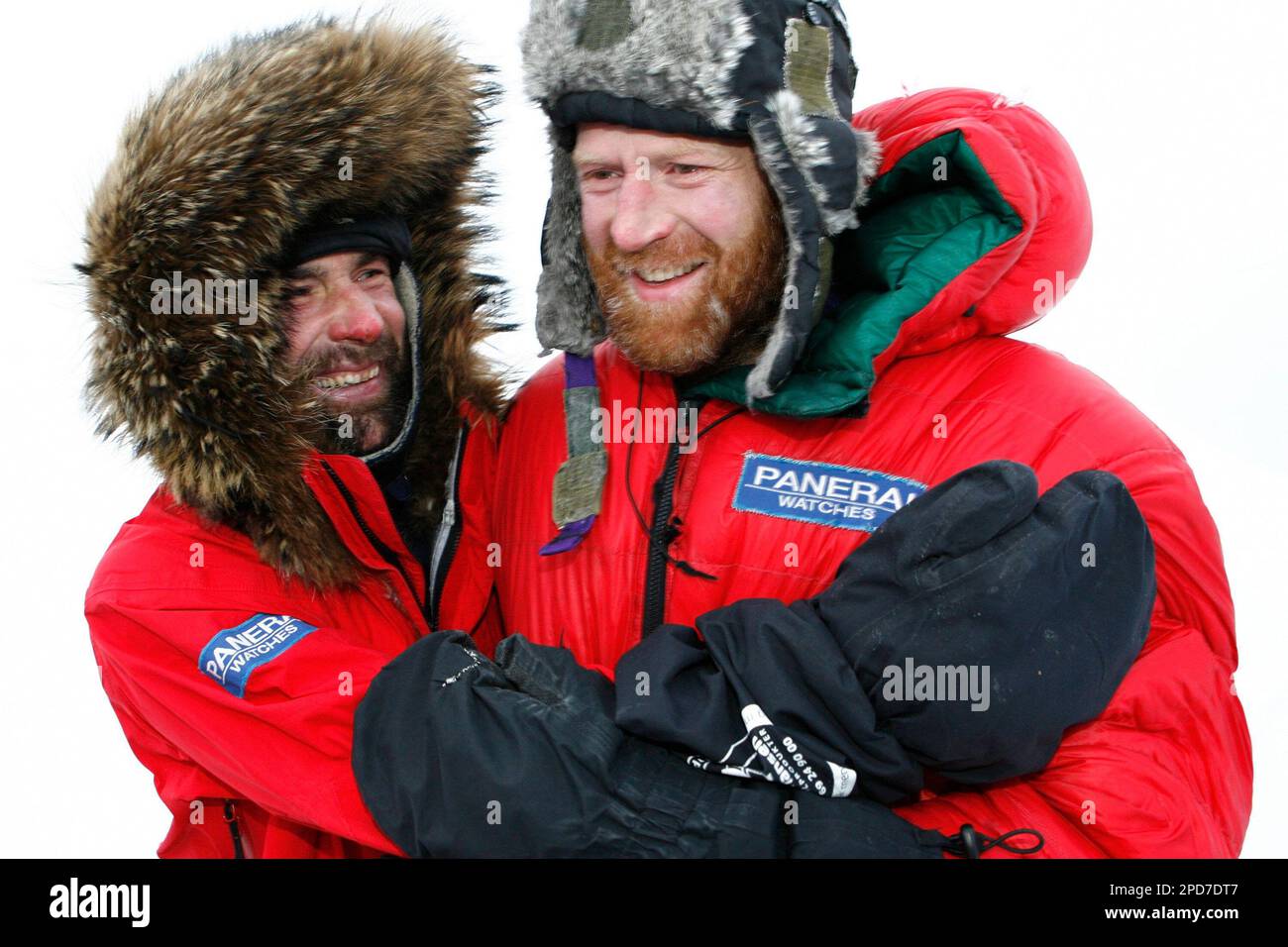 South African adventurer Mike Horn, left, who lives in Switzerland and  Norwegian explorer Borge Ousland, right, celebrate the end of their  expedition "North Pole Winter Expedition" at the Barneo ice camp 50