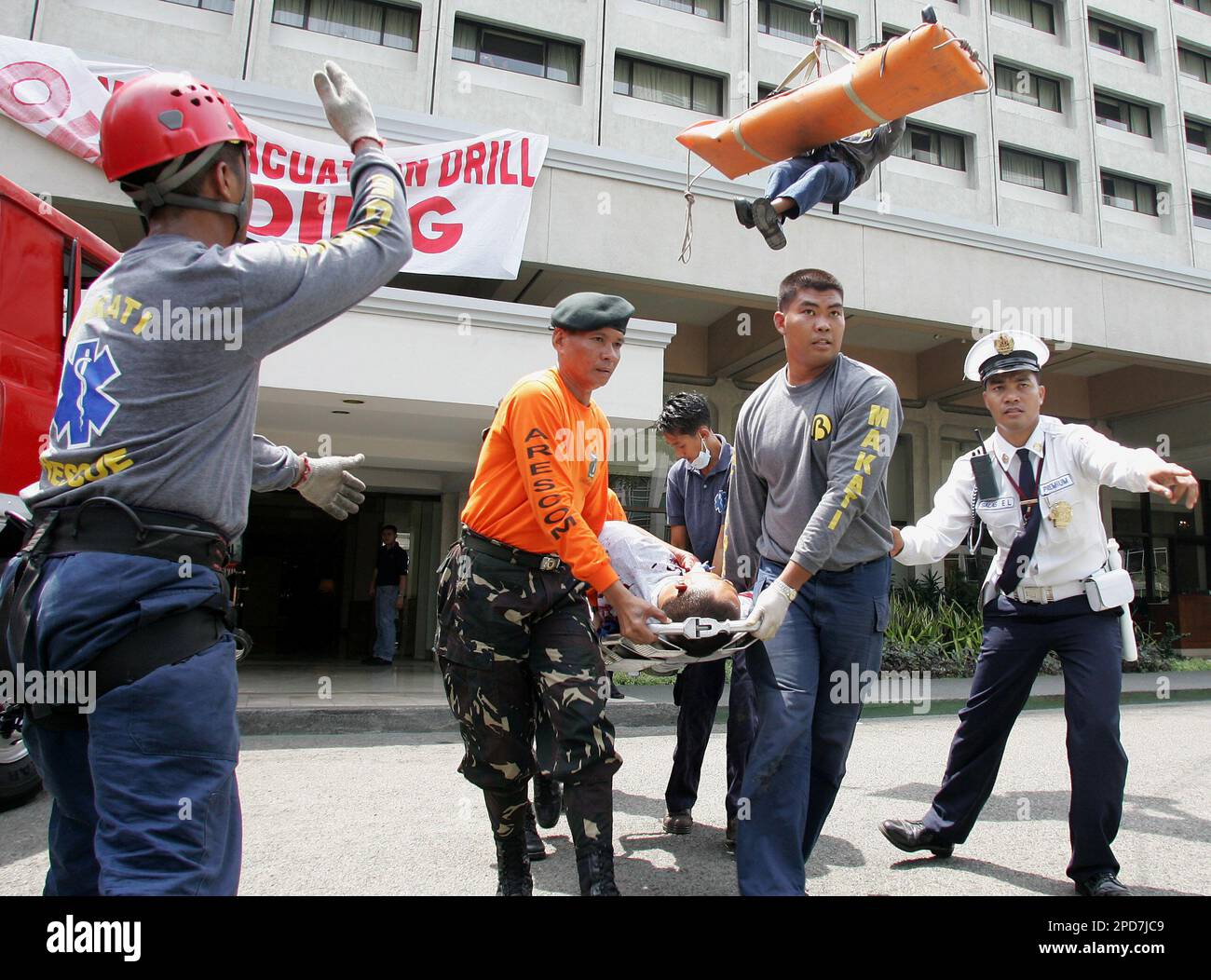 Philippine Rescuer Model Filipino rescuers bring down a mock victim during an evacuation and ...