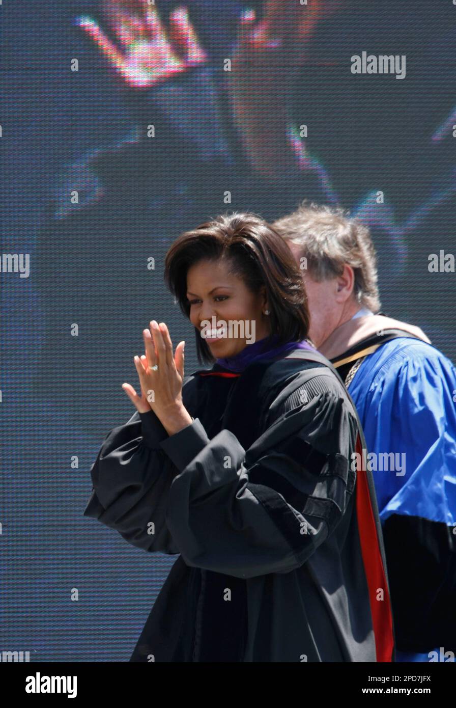 First lady michelle obama claps to the graduatuing upon entering the