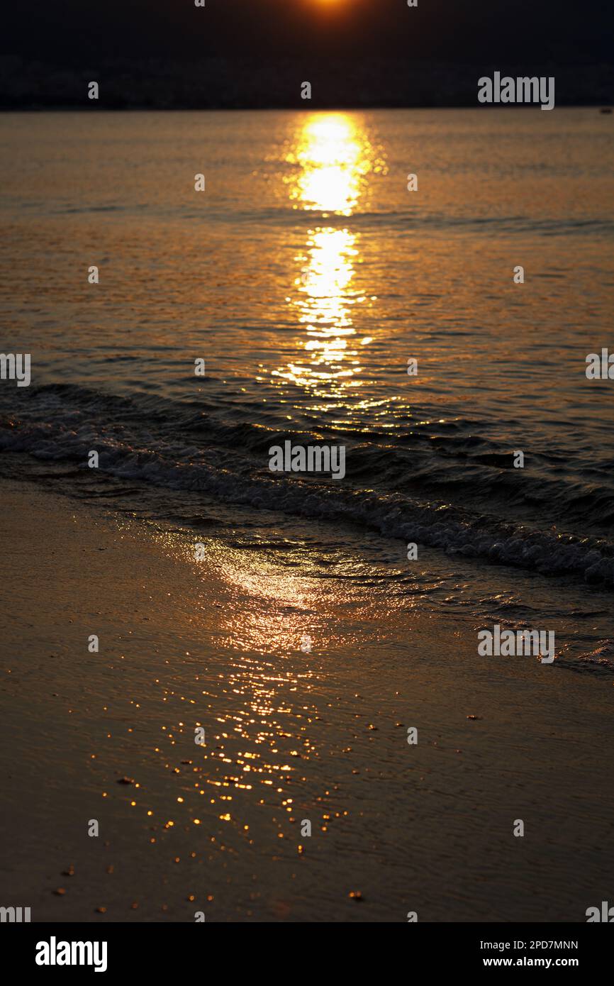 Early summer sunrise at sea, first rays of sun began to appear on