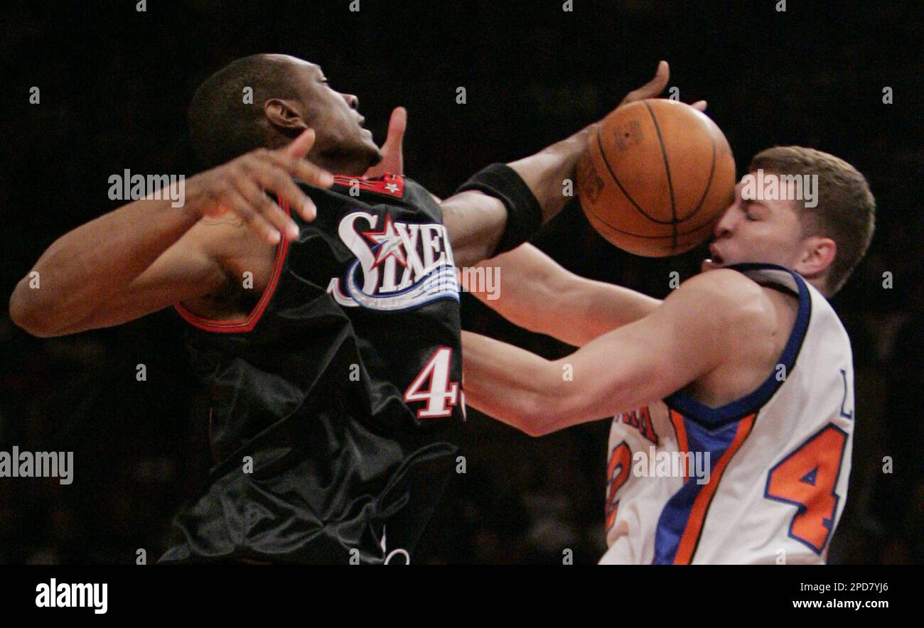 Philadelphia 76ers' Steven Hunter, left, blocks a shot by New York