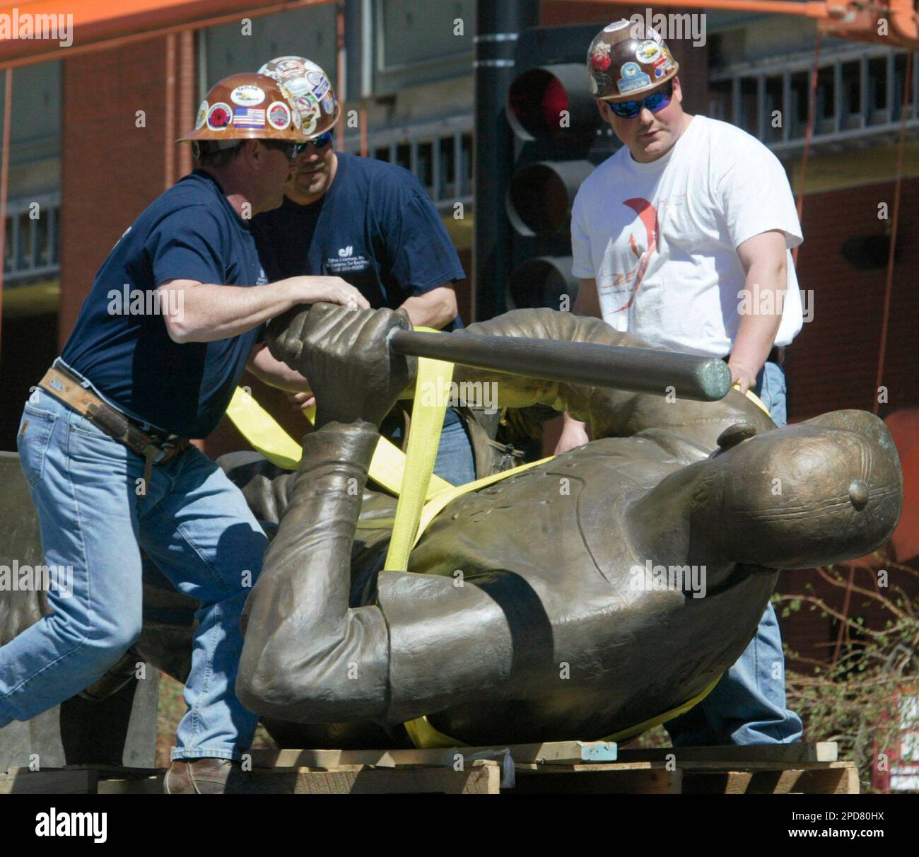 Statue Hoisting Construction workers prepare to hoist the statue of St. Louis Cardinals ...
