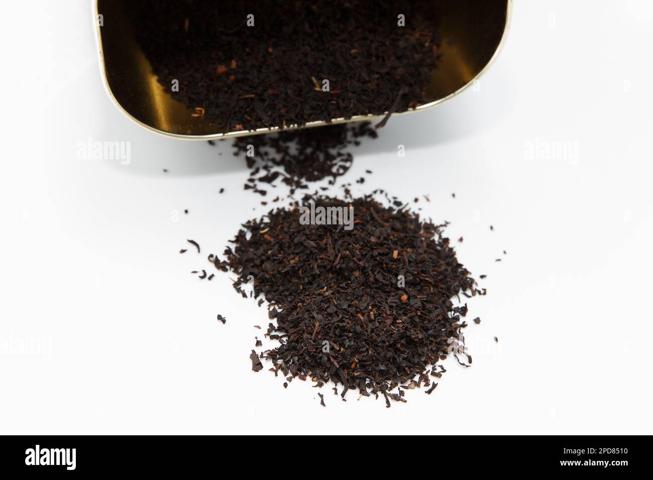 Fragrant dry large tea scattered from the package with bergamot on a ...