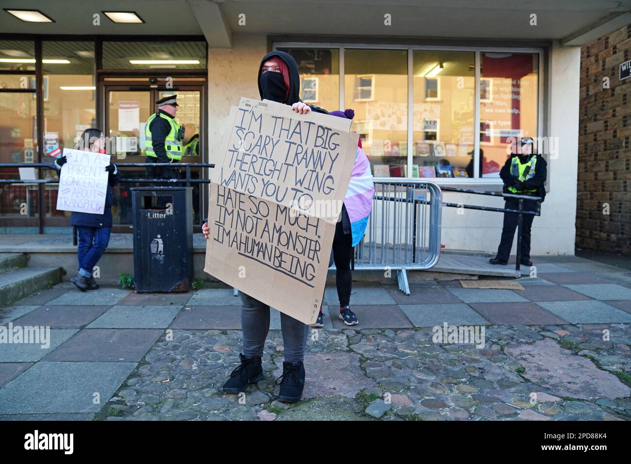 A Trans rights activist take part in a demonstration outside Portobello Library, Edinburgh