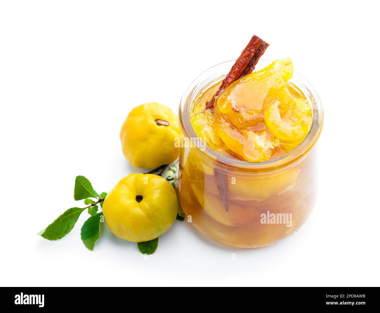 Homemade quince jam in glass jars and fresh quince with leaves isolated