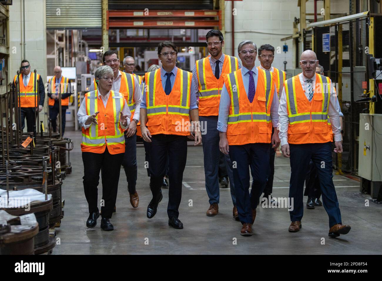 Prime Minister Justin Trudeau walks the production line in the Michelin ...