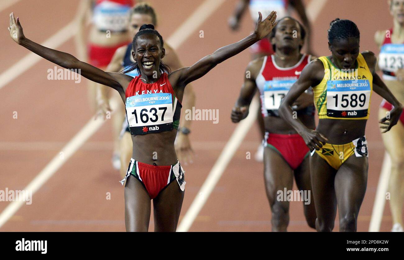 Kenya's Jepkosgei, left, celebrates as she crosses the finish