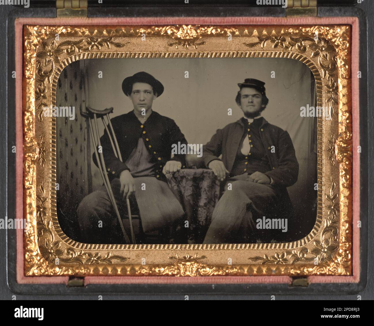 Two unidentified soldiers in Union private's uniforms sitting next to ...