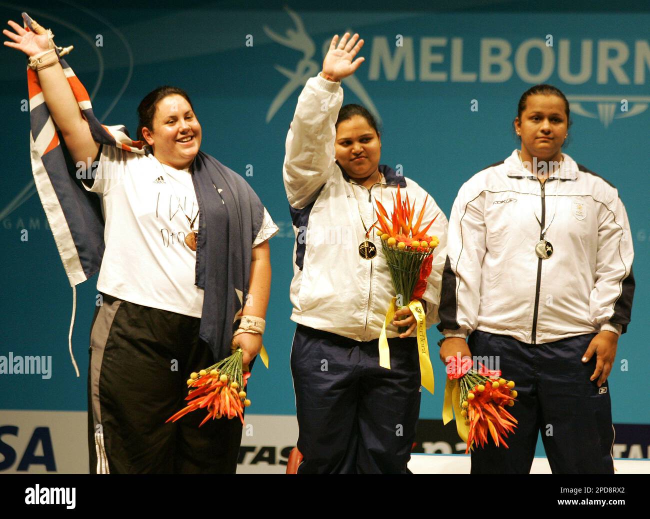 Gold medal winner India's Geeta Rani, center, waves as she poses with ...