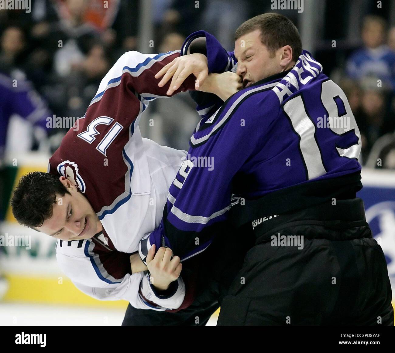 Colorado Avalanche's Dan Hinote, left, punches Los Angeles Kings' Sean