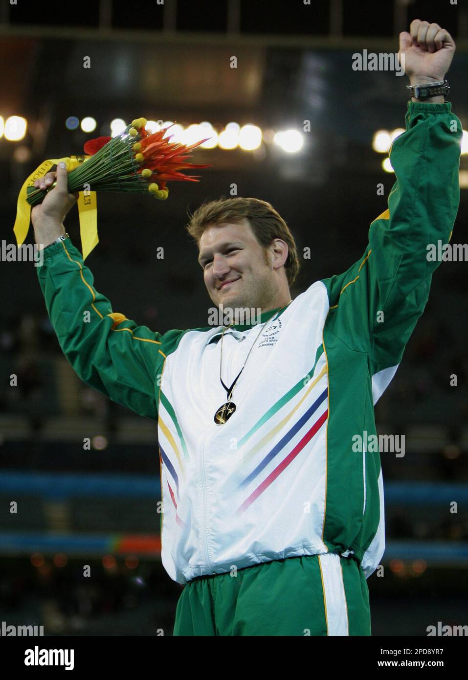 South Africa's Janus Robberts celebrates after winning the gold medal in the Men's Shot Put at the Melbourne Cricket Ground during the Commonwealth Games in Melbourne, Australia Monday March 20, 2006. (AP Photo/Alastair Grant) Stock Photo