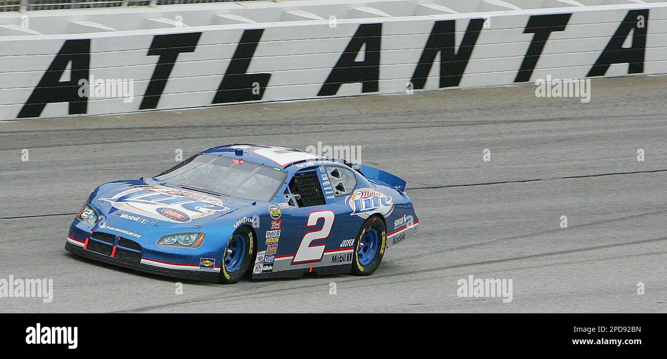 NASCAR driver Kurt Busch roars by in his Miller Lite dodge while leading at lap 30 of the NASCAR