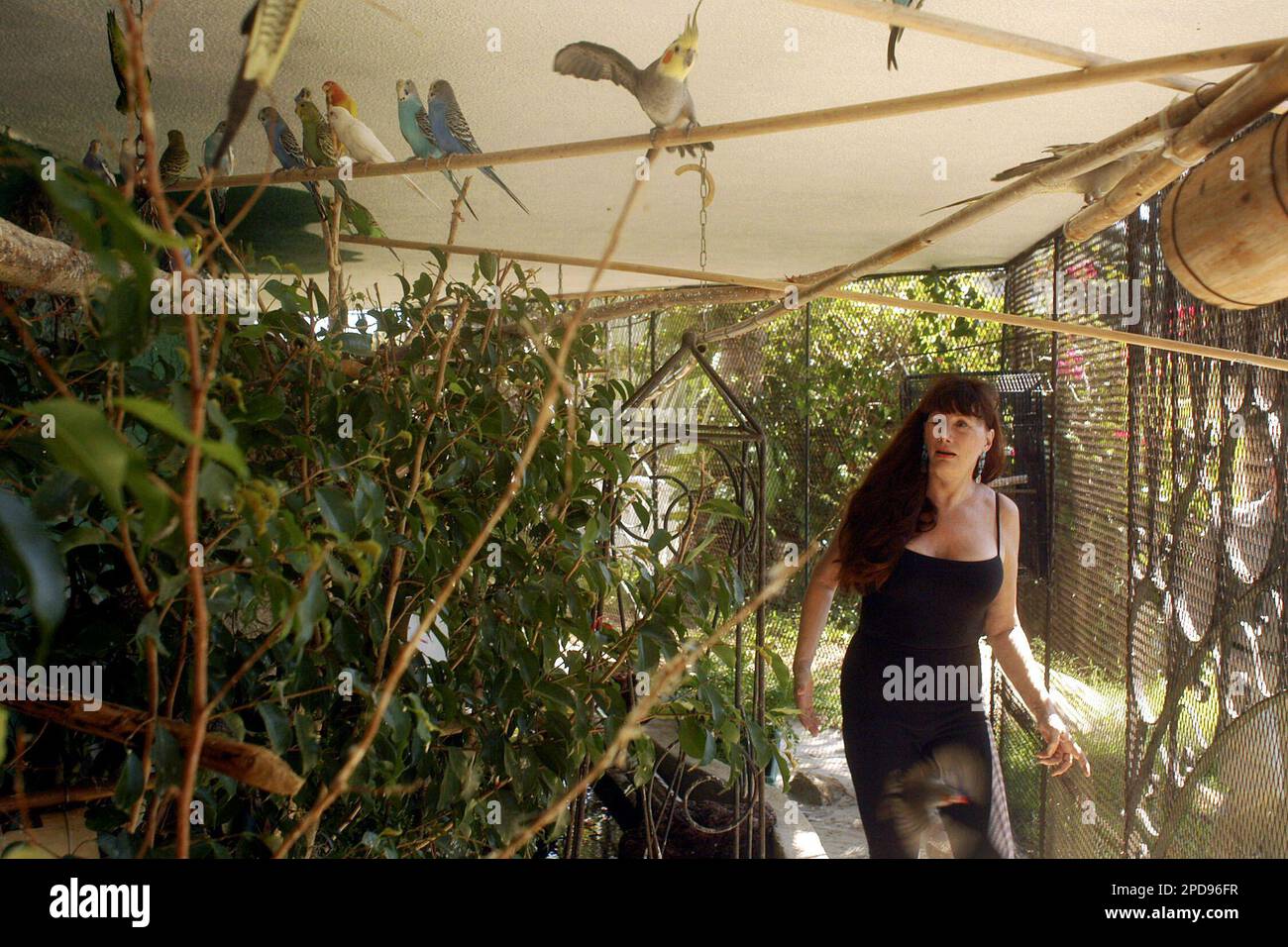 Bernadette Feazell, 58, a native of Waco, Texas, walks inside a bed and
