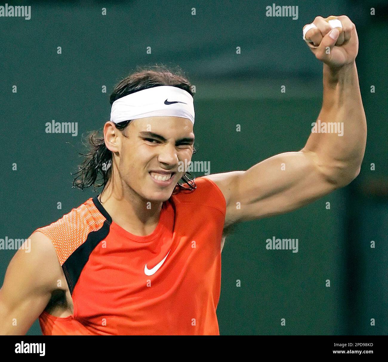 Rafael Nadal of Spain flexes his muscle after defeating Marcos Baghdatis of  Cyprus, 7-5, 6-