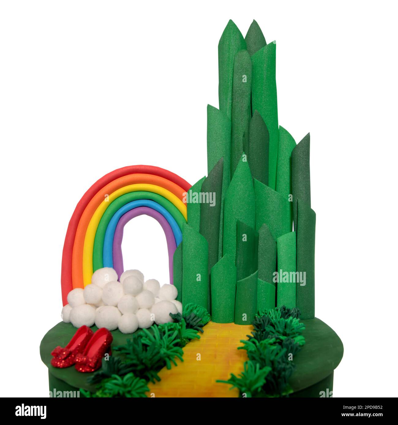 Many character in wizard of OZ. Magical fantasy team on cake made of craft paper. Emerald city gate and rainbow. Design cake of the theme is inspired Stock Photo