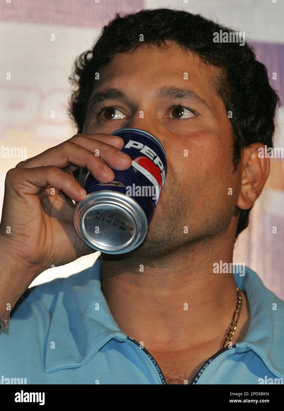 Indian cricketer Sachin Tendulkar drinks a soft drink during a