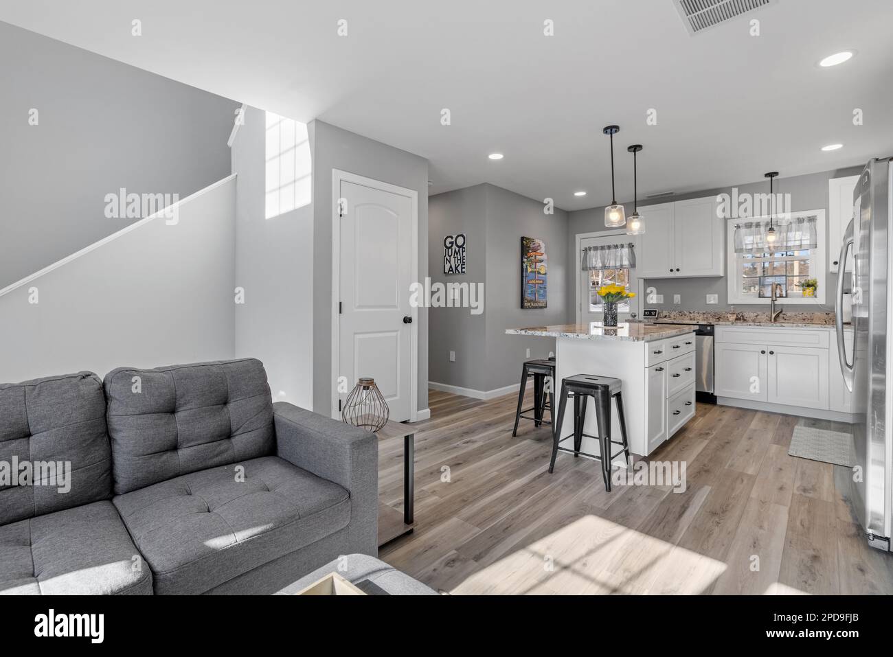 A studio apartment with lightcolored walls separating a modern living