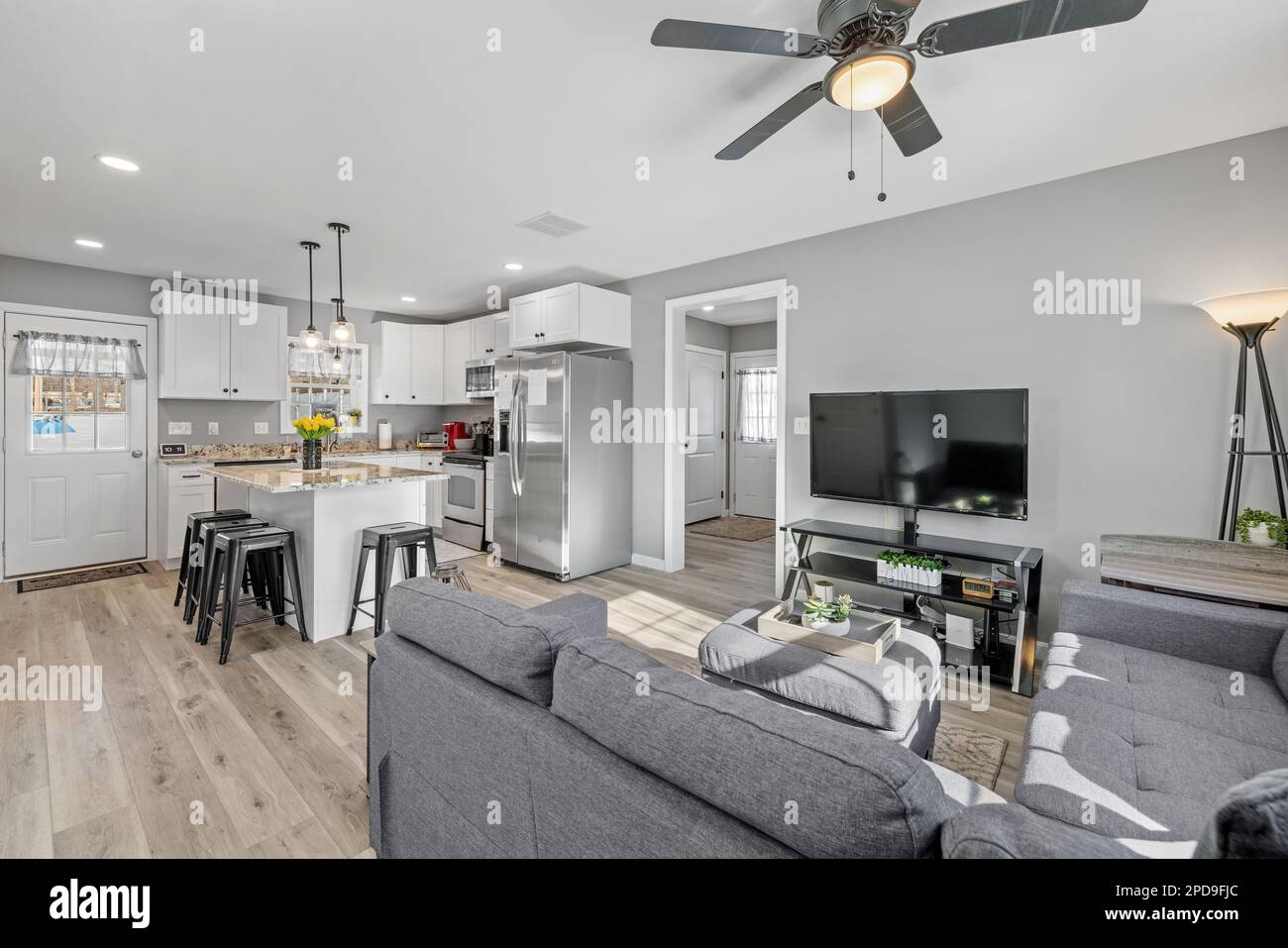 A studio apartment with lightcolored walls separating a modern living