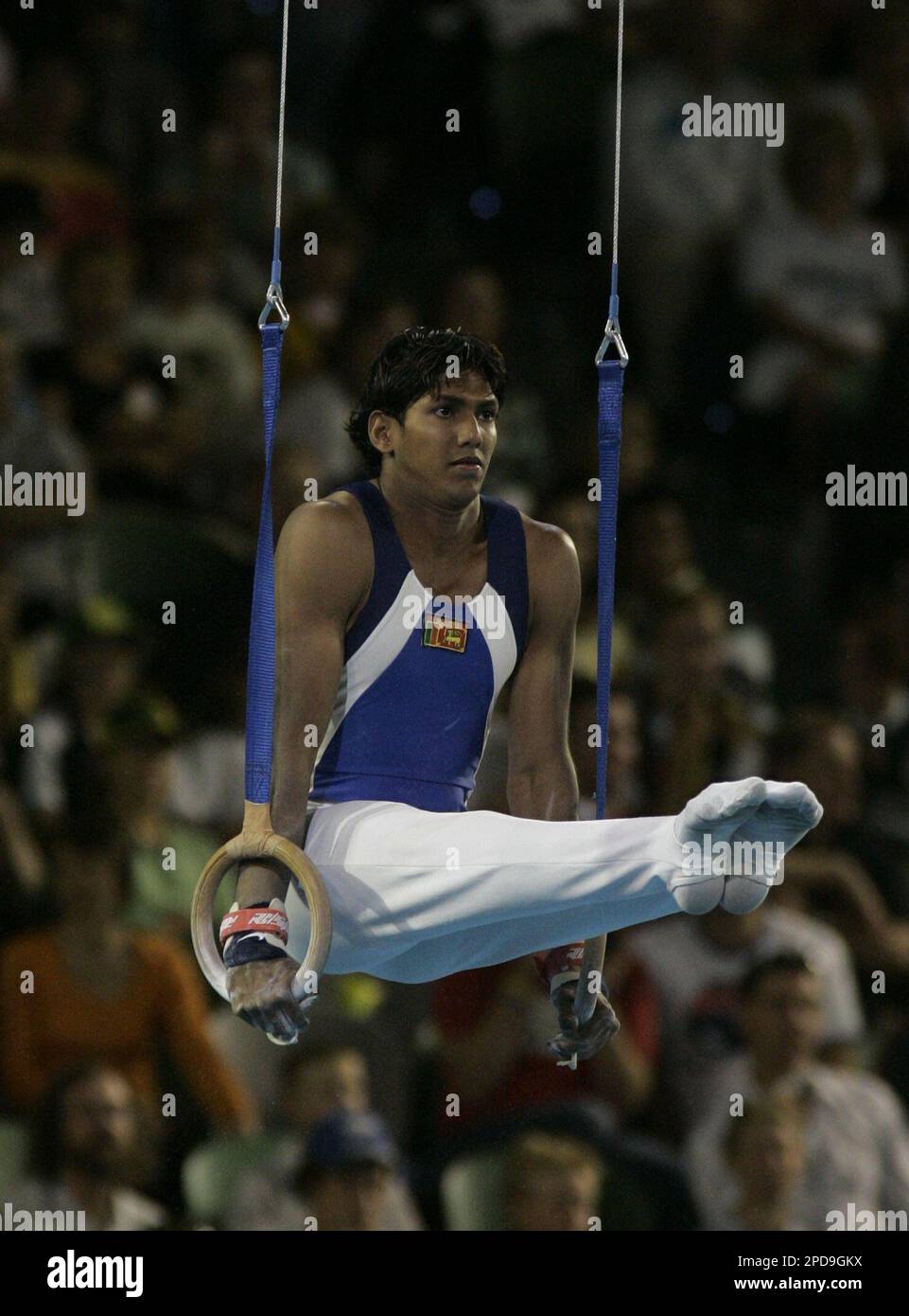 Sri Lanka's Gunasekara Dias performs his routine on the rings during