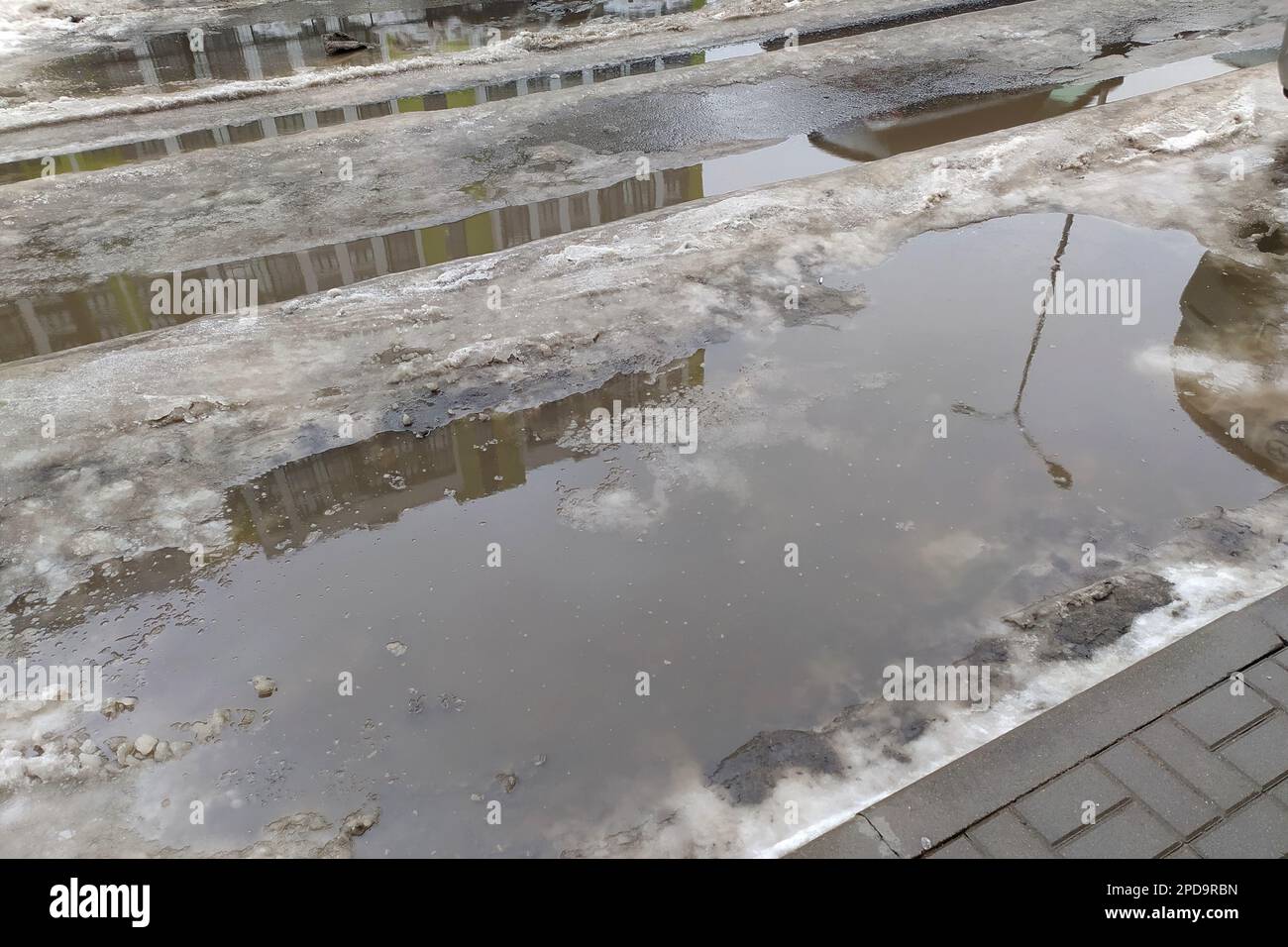 Russian Federation. Saint Petersburg. March. Puddles on roads and ...