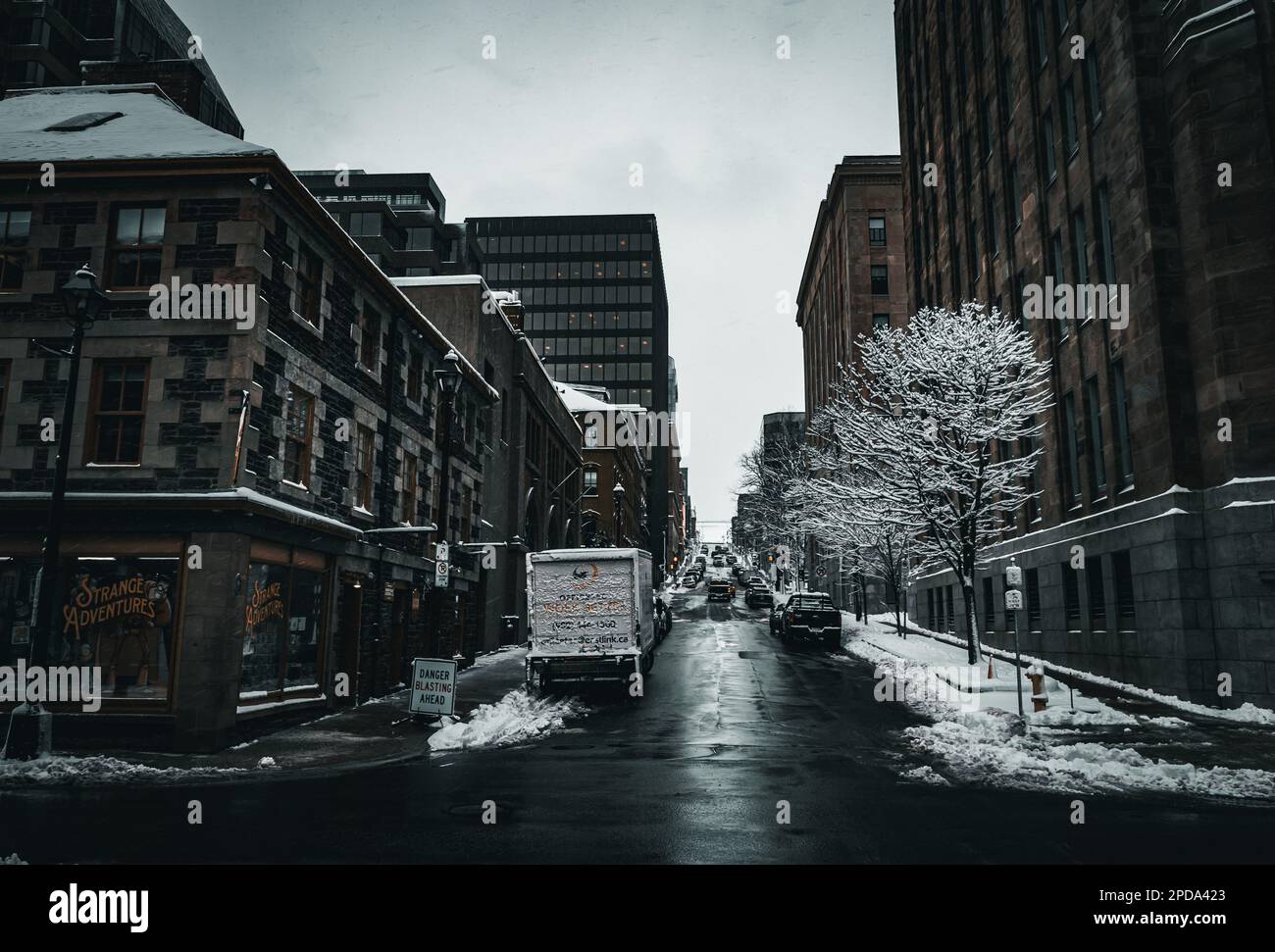 photo looking up prince street from lower water street in depths of winter beinf flanked by Dominion Public Building, Mitchell House, Old Fire Station Stock Photo