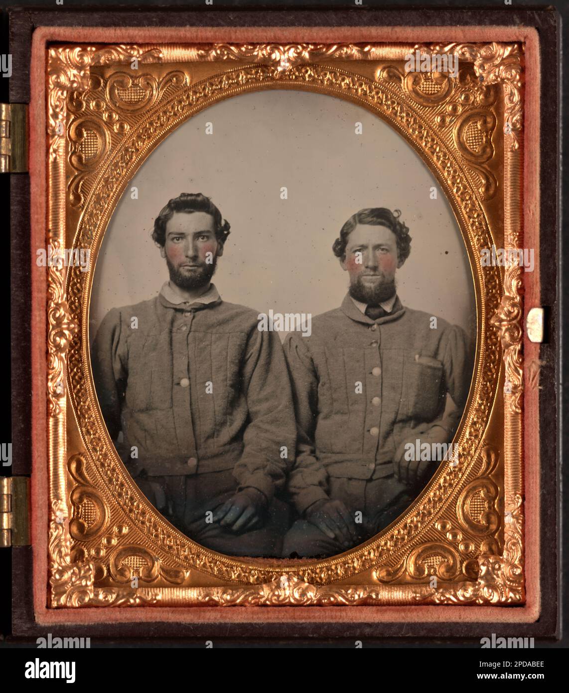 Two unidentified soldiers in Confederate uniforms with Virginia buttons ...