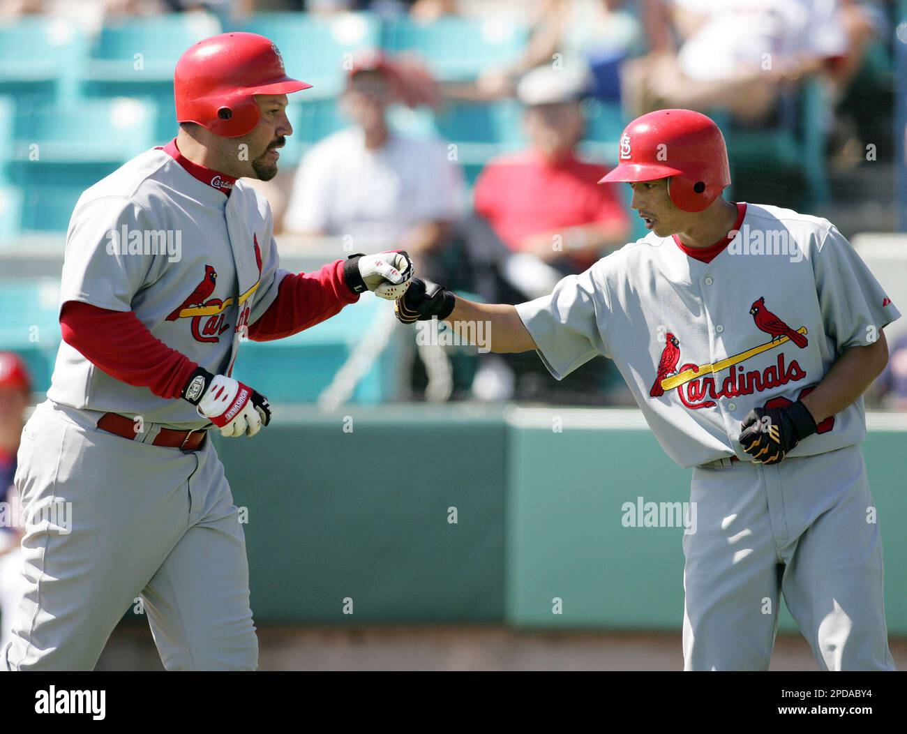 St. Louis Cardinals' So Taguchi is congratulated by third base