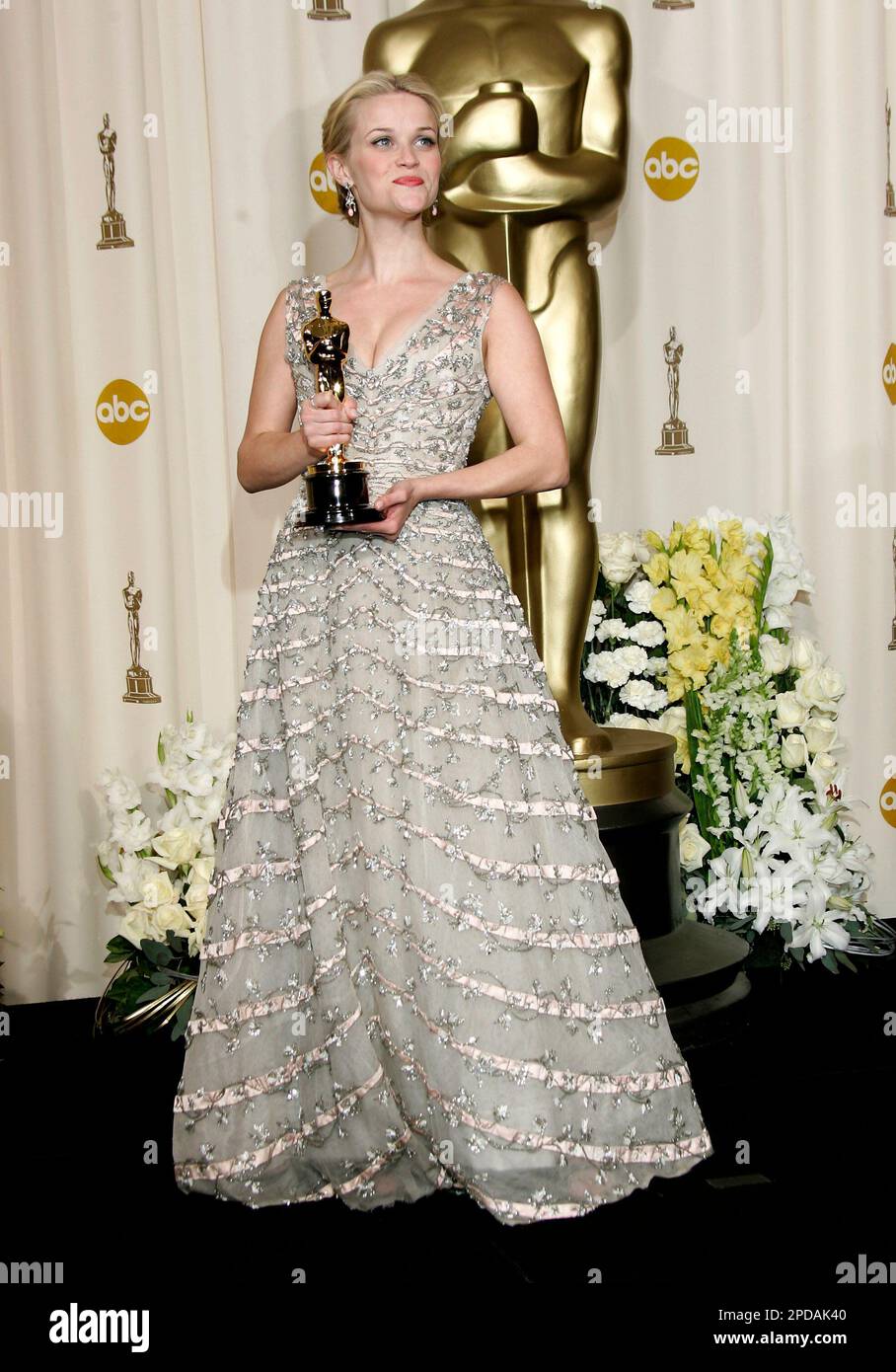 Actress Reese Witherspoon poses with the Oscar she won for best actress ...