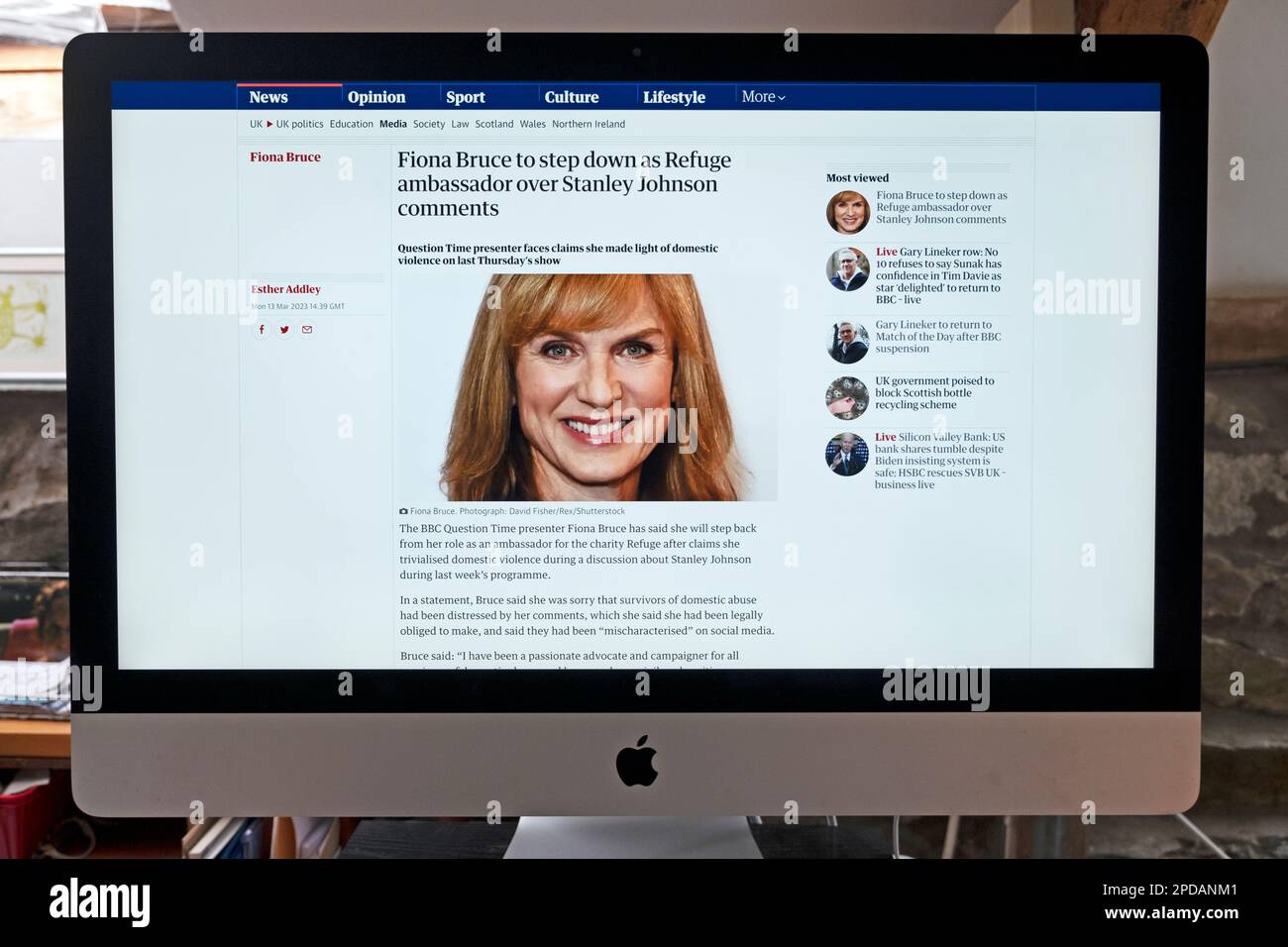 'Fiona Bruce to step down as Refuge ambassador over Stanley Johnson comments' Guardian newspaper headline on website screen on 13 March 2023 London UK Stock Photo