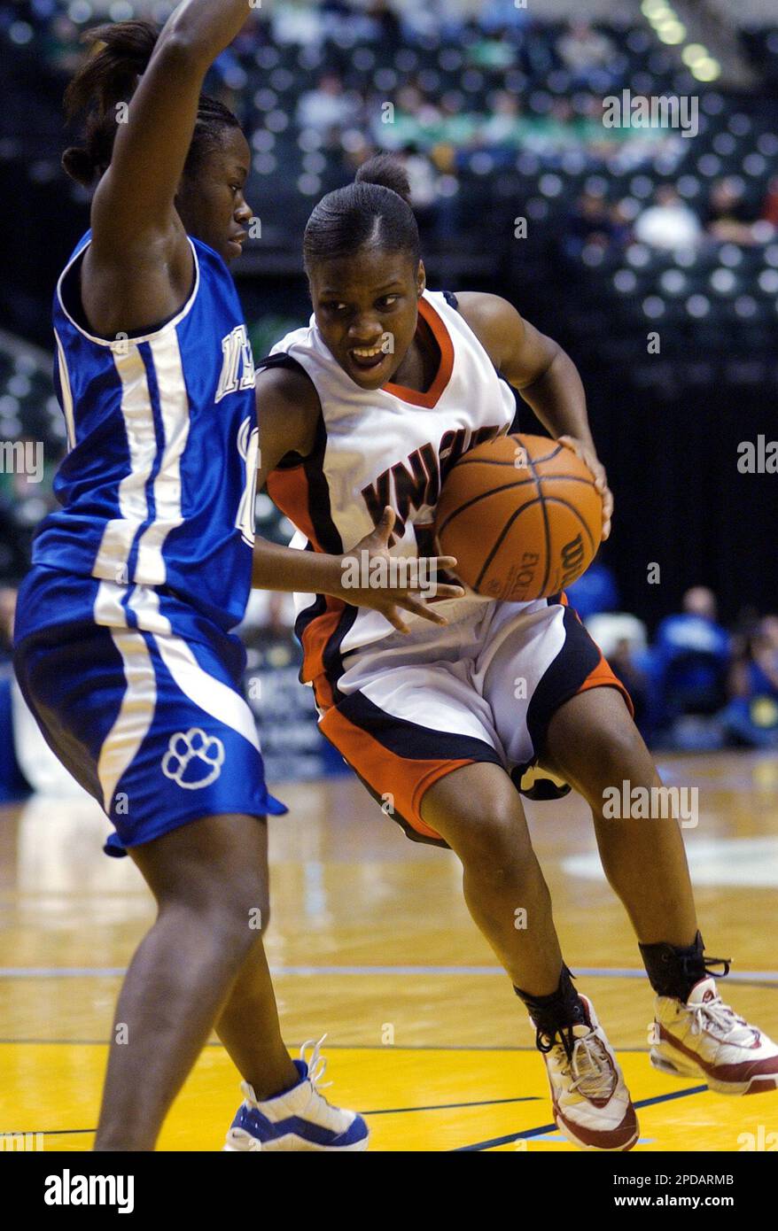 Ft. Wayne Luers' MarKee Martin drives on Evansville Memorial defender ...