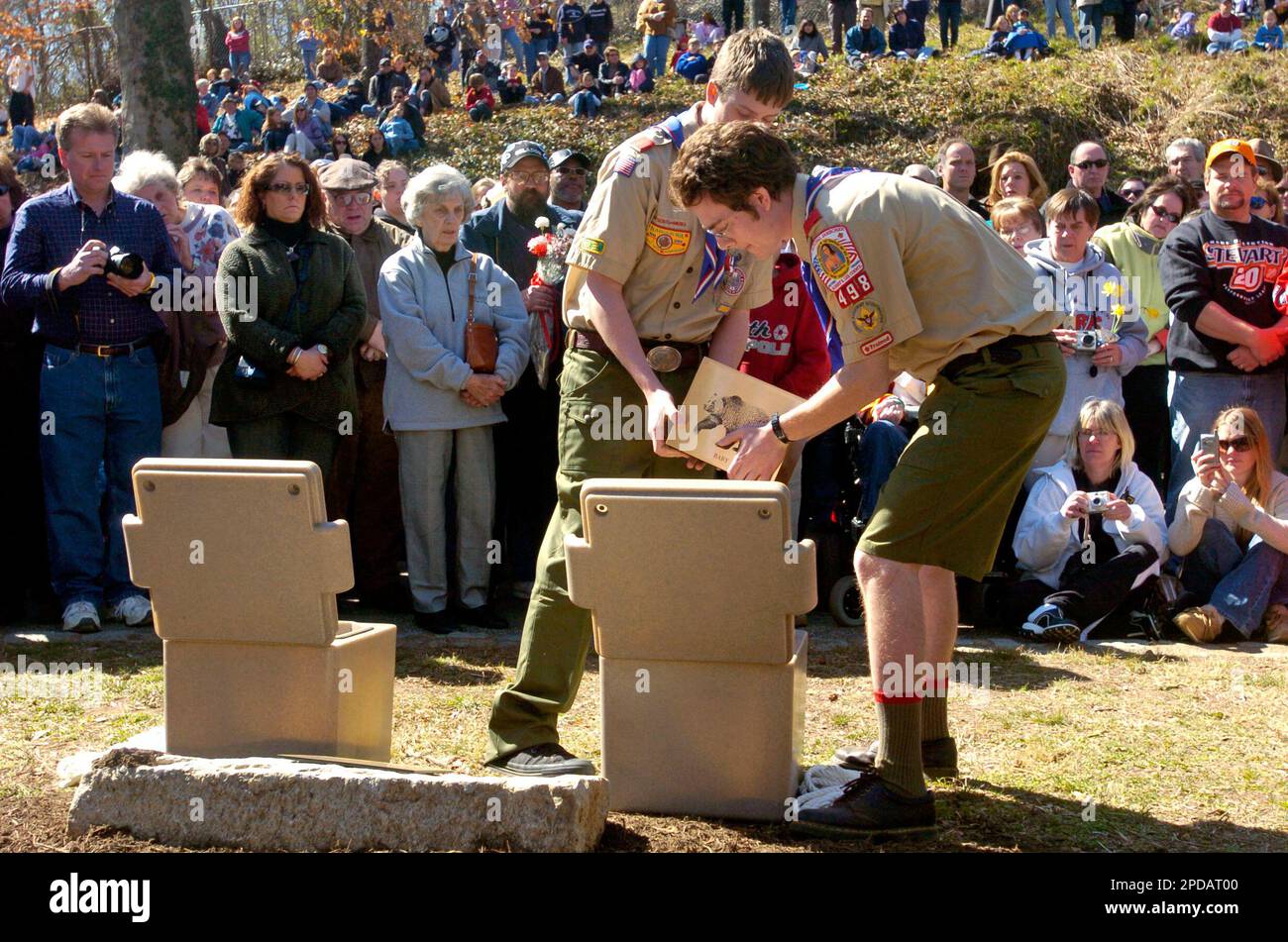 Ethan Pyle, left and Stavros Calos, boy scouts with Troop 498, lowered ...
