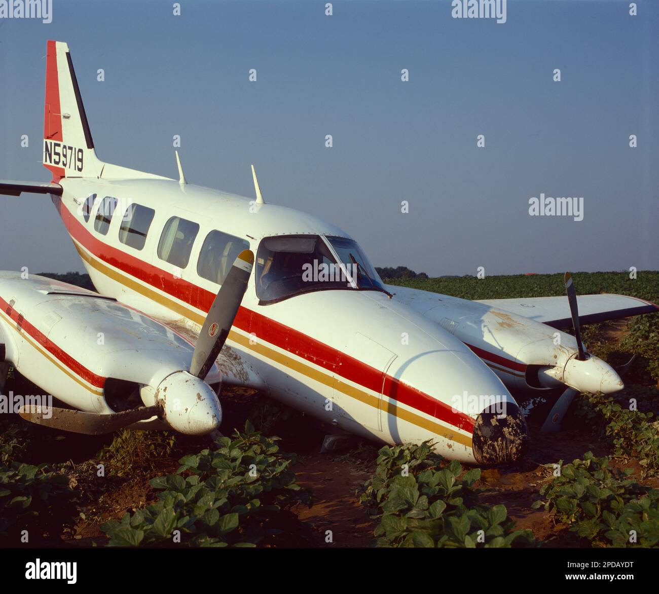 Twin-engine general aviation aircraft crashed into a farmer's field Stock Photo