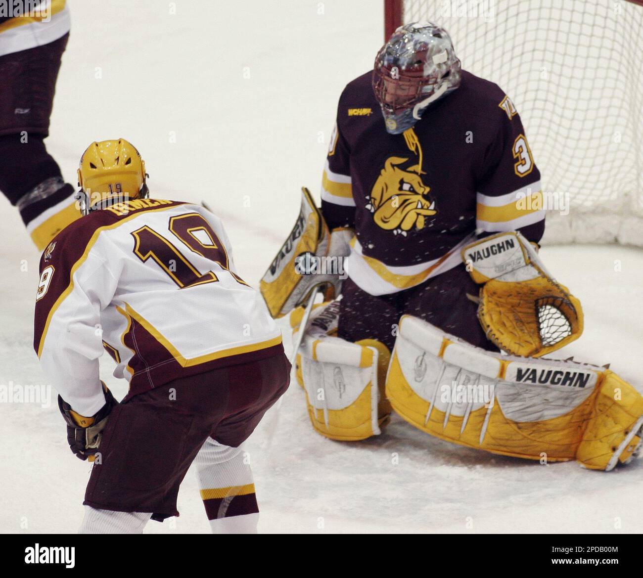 MinnesotaDuluth goalie Isaac Reichmuth (39) stops a shot by Minnesota