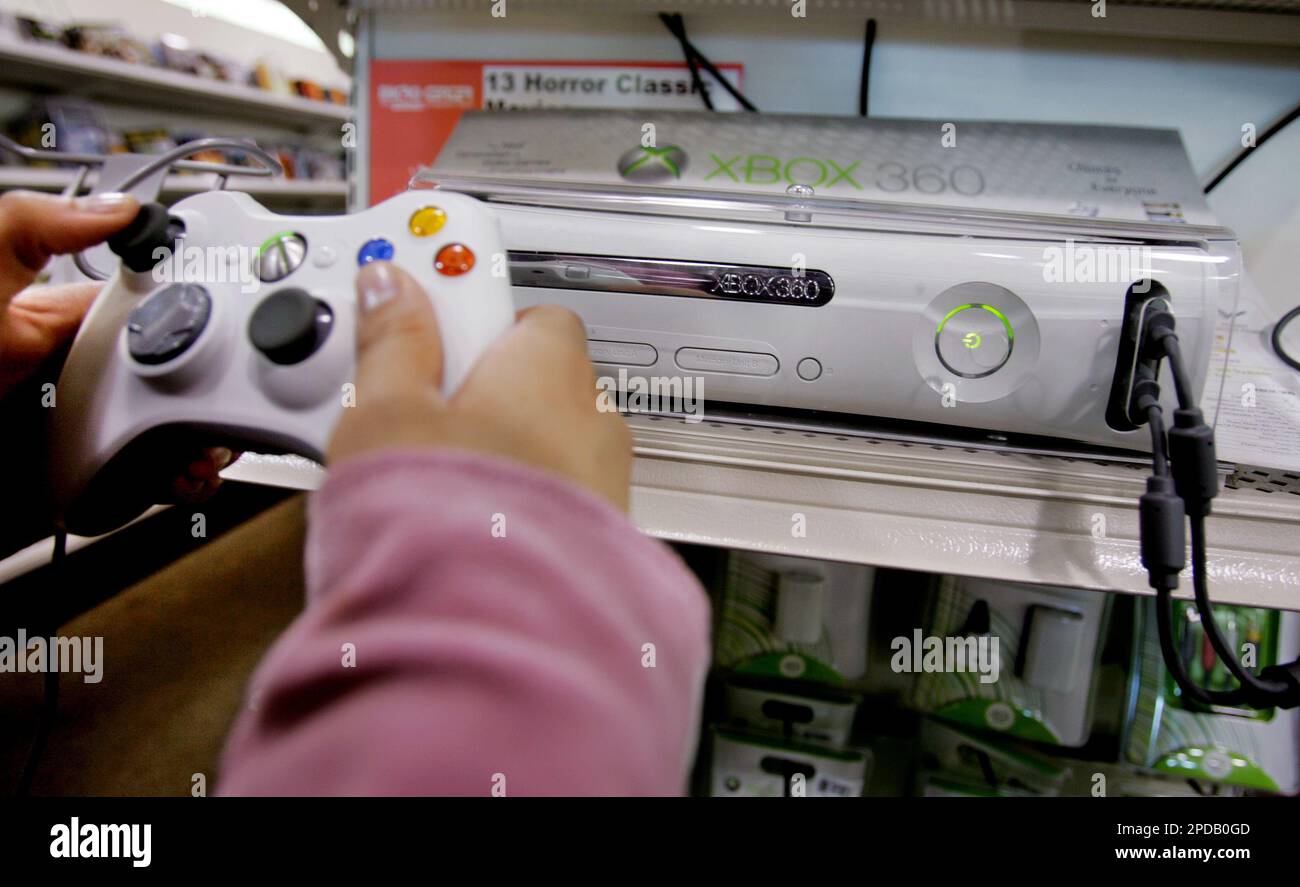 Christine Canasa plays a game using the new Xbox 360 game console at Micro  Center computer store in Santa Clara, Calif., Monday, Feb. 28, 2006. bWith  enough hardware horsepower to deliver movie-like
