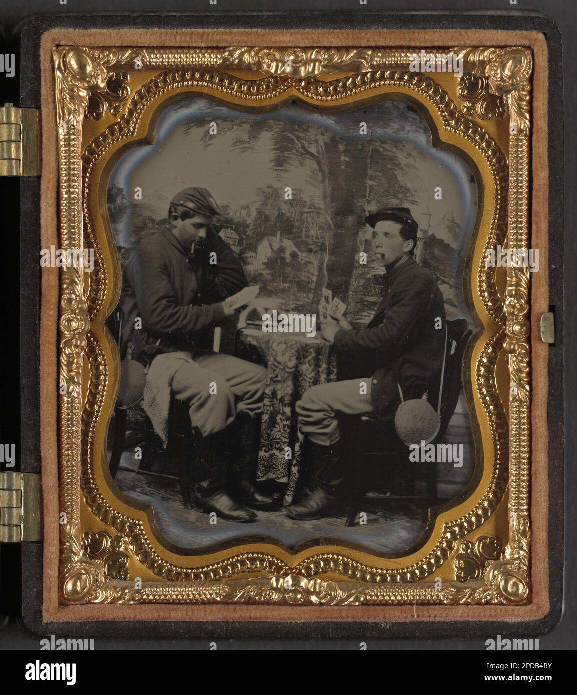 Two unidentified soldiers in Union uniforms with canteens playing cards ...