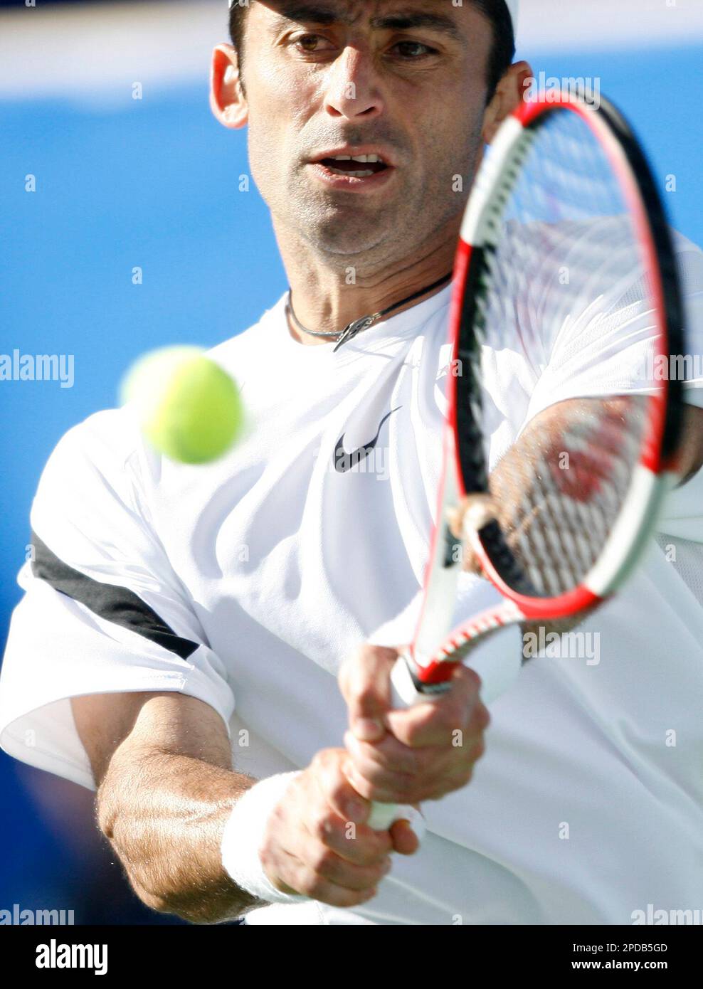 Armenian Sargis Sargsian returns the ball to Nicolas Kiefer of Germany during the first round of the Tennis Channel Open tennis tournament in Las Vegas, Tuesday, Feb