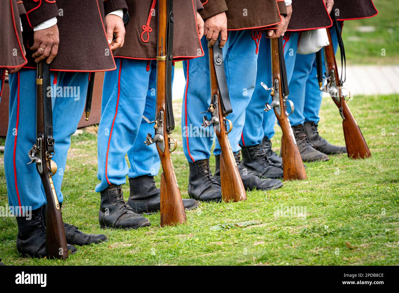 Row of 19th century uniformed hungarian soldiers with rifles Stock Photo